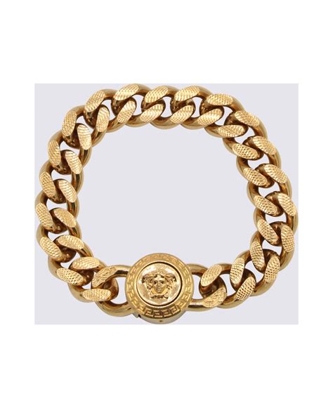 versace goldtone bracelet.